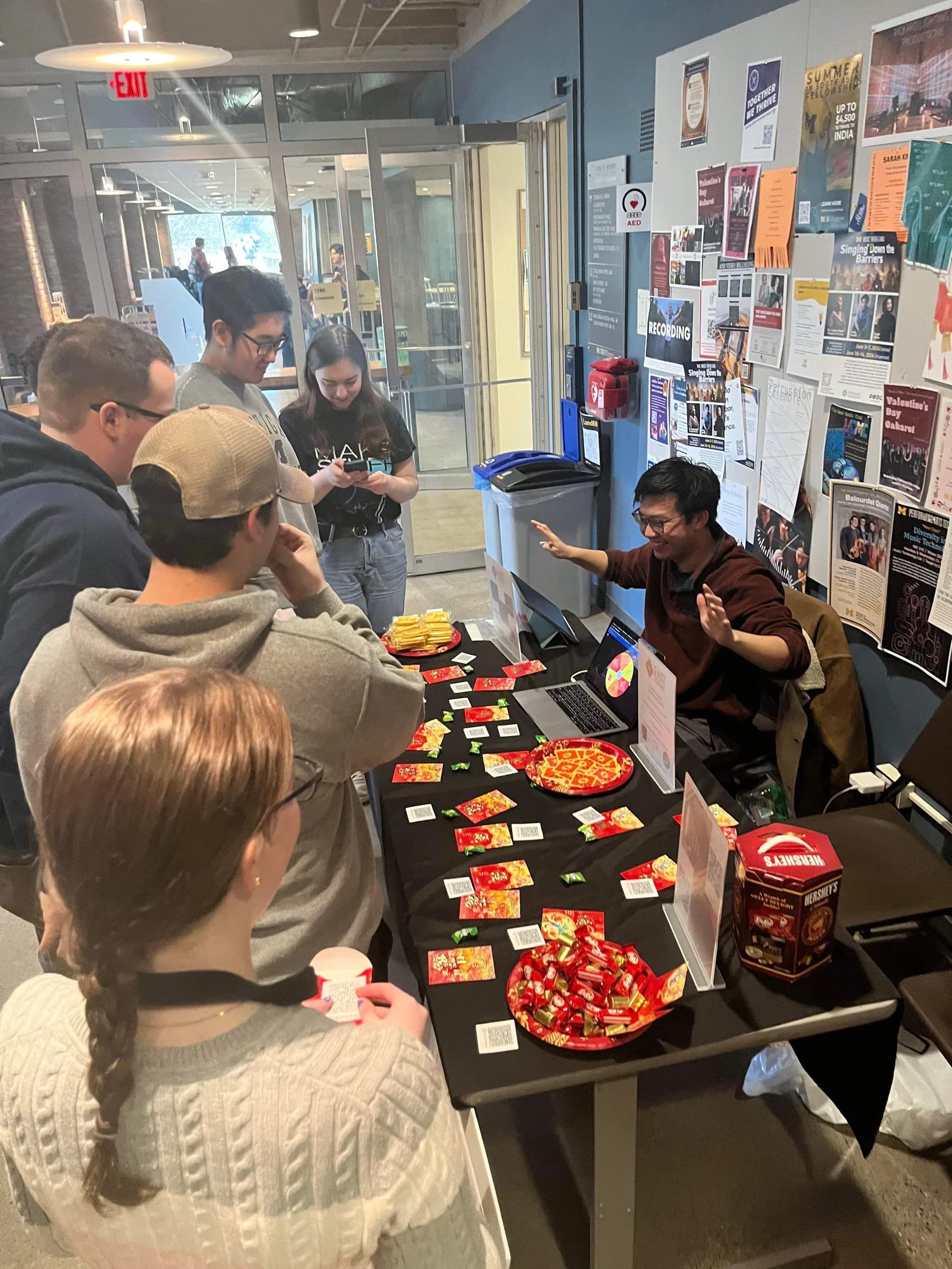 Campus outreach table introducing East Zodiac to students